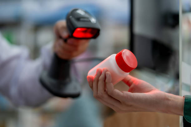 Barcode scanner checking a product bottle for expiry management